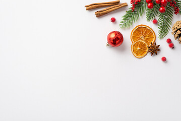 New Year concept. Top view photo of red bauble pine cone dried orange slices cinnamon sticks anise...