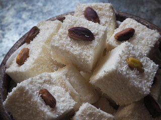 Traditional Turkish delight with pistachio and coconut coating.   