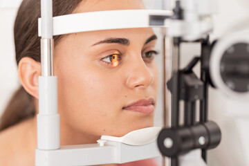 Vision, eyesight and woman gets ophthalmology eye exam with light on iris testing to see sight....