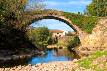 Fototapeta na wymiar Lierganes Cantabria Spain ancient roman bridge over River Miera in pretty village located 15 miles from Santander