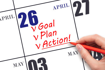 Hand writing text GOAL PLAN ACTION on calendar date April 26. Motivation for a new day. Business...