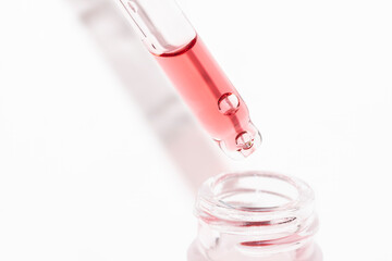 close up of pipette dropper with chemical acid peeling serum