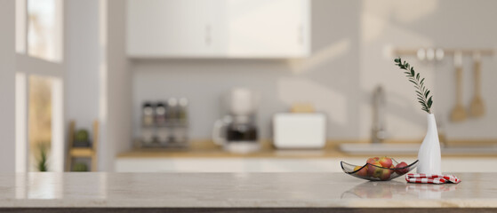 Elegant white kitchen tabletop with copy space over blurred modern white kitchen