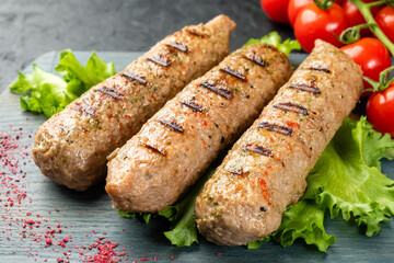 Kebab close-up, three sausages and soy meat. Vegetarian Lula kebab.