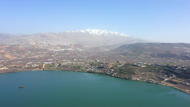 Ram Lake and snowy mount Hermon in Northern Israel, Drone footage