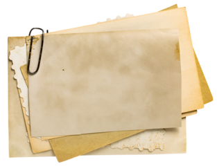 Stack of old blank photos with metal clip