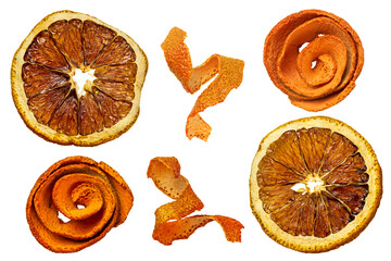 Round dried orange slices and twisted strips of orange peel close-up 