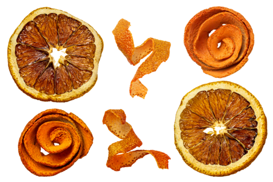 Round dried orange slices and twisted strips of orange peel close-up 