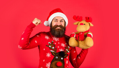 Great present. christmas online shopping. brutal man hold reindeer toy. winter holiday party....