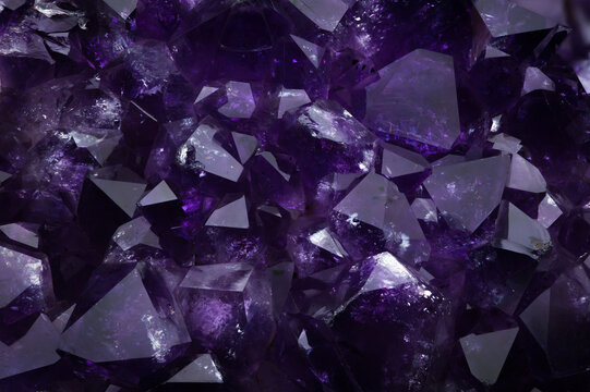 amethyst macro detail texture background. close-up raw rough unpolished semi-precious gemstone purple, violet