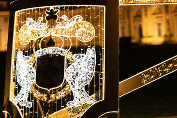 Light decorations in the park. Figures made of Christmas lights that look like gods and planets. An...