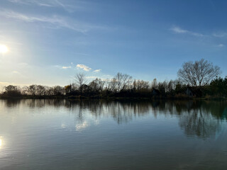 Autumn mood landscape with lake and forest in the perfect sunny weather