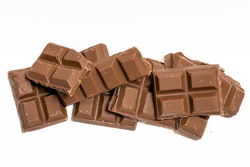 Crushed chocolate bars isolated in white. stacked. with copy space for texts