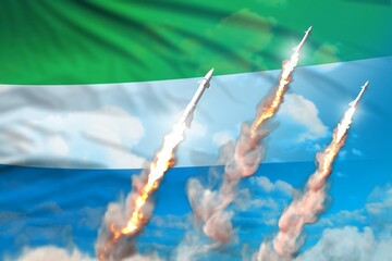 Sierra Leone nuclear missile launch - modern strategic nuclear rocket weapons concept on blue sky background, military industrial 3D illustration with flag