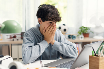 Confused student looking at the laptop screen