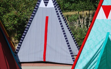 Colorful teepees outside.