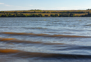 River waves , windy weather , wavy water surface
