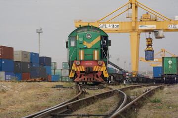Khorgos, Kazakhstan - 09.22.2022 : A freight locomotive on the railway tracks of the Khorgos border...