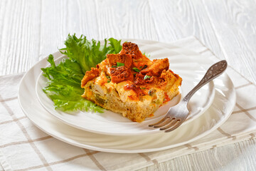 Scalloped Chicken Casserole topped with croutons
