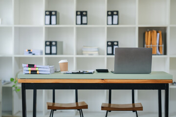 Work place, laptop on the table, no people