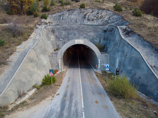 Entrance of road tunnel. Heading through the mountain, on the road.