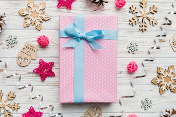 Christmas composition. Gifts box with new year decorations on colored background. Christmas, winter, new year concept. Flat lay, top view, copy space