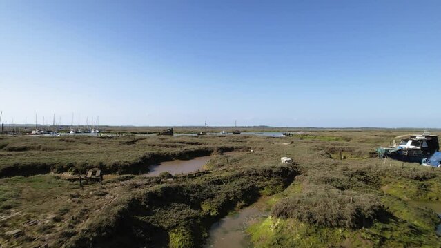 Shipwreck in Swamp Marshes on River Blackwater near Tollesbury Marina, Essex, UK - Aerial Drone Flight