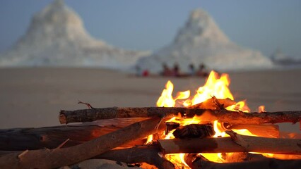 warm bonfire burning fresh wood in the desert during the sunset waiting for night camp during adventour travel tour 