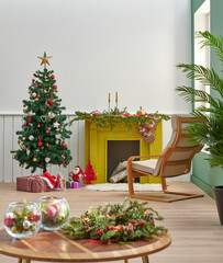 Close up new year concept middle table, yellow fireplace background, white and green wall background, Christmas tree ornament style.