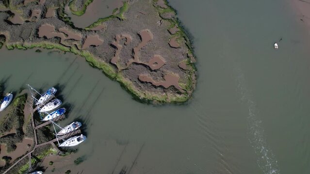 Shipwrecked Boats in Blackwater River near Tollesbury Marina, Essex, UK - Aerial