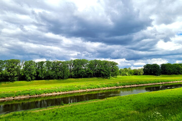 Dramatic sky before a thunderstorm on the riverbank.