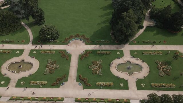 Designs and geometries of Thabor gardens with fountains and flower beds at Rennes in France. Aerial top-down sideways