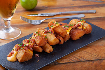 fried yucca with sauce and bacon