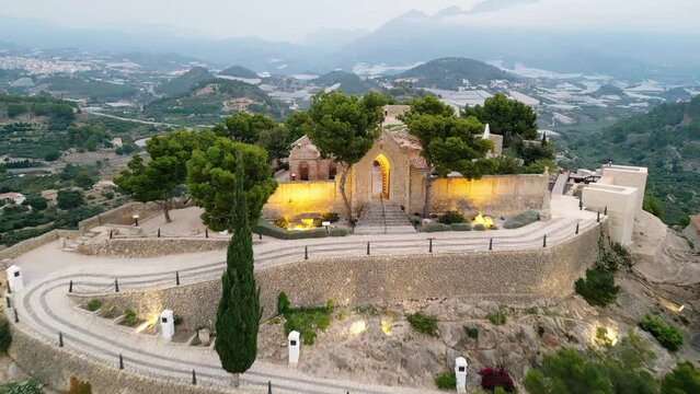 Aerial view of village historic stone buildings and Mausoleum Ruins in Polop, Spain