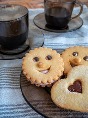 cup of black coffee with biscuits, breakfast concept