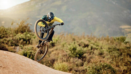 Bicycle, biker and jump in air for competition, mountain biking and extreme sport with helmet,...
