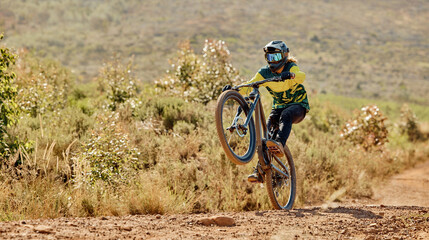 Mountain bike, sport and fitness outdoor with athlete doing stunt for extreme sports on dirt track...