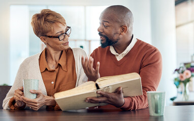 Couple reading bible, home faith and talking about religion with coffee for learning, study and...