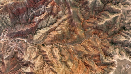 A drone photograph of the mountains in Aksaray, Turkey. Bird's eye view of brown mountain.