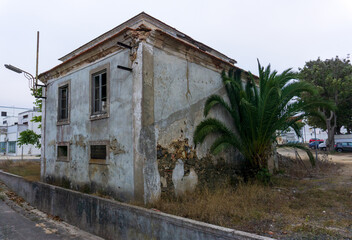 A dilapidated abandoned building in the center of the small Portuguese town