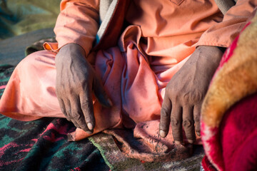 July 14th 2022, Himachal Pradesh India. Closeup of hands of an of an Indian Sadhu in traditional...