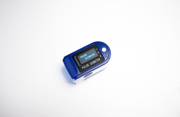Portable pulse oximeter on a white background.A medical heart rate monitor. Compact device for measuring the air level in the lungs.