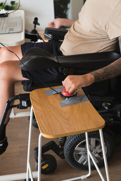 disabled man using computer, with special adaptive devices