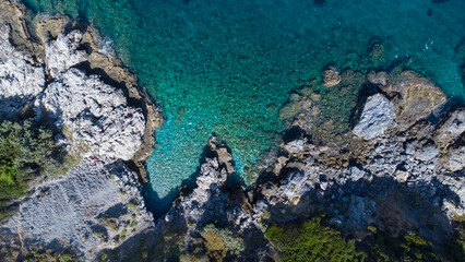 Aerial view of turquoise blue Mediterranean water on the coast of Samos, Greek Aegean Sea
