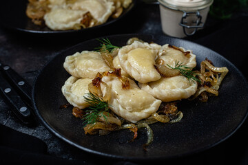 Vareniki with potatoes and onions in a plate. Ukrainian food