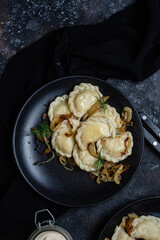 Vareniki with potatoes and onions in a plate. Ukrainian food