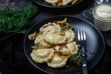 Vareniki with potatoes and onions in a plate. Ukrainian food