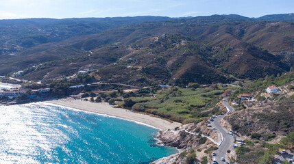Aerial view of lovely greek fisher town of Armenistis in a quiet summer morning. Port with local...