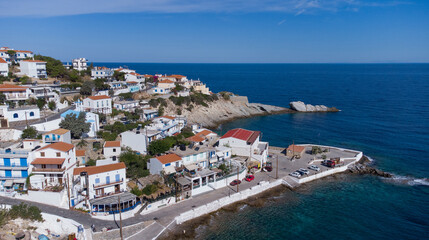 Aerial view of lovely greek fisher town of Armenistis in a quiet summer morning. Port with local...
