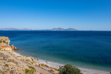 Turquoise clear blue water on a small beach in Ikaria, Greek Aegean Sea